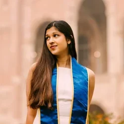 Asha Kar in graduation attire, presently a graduate student researcher in the Pajukanta lab.